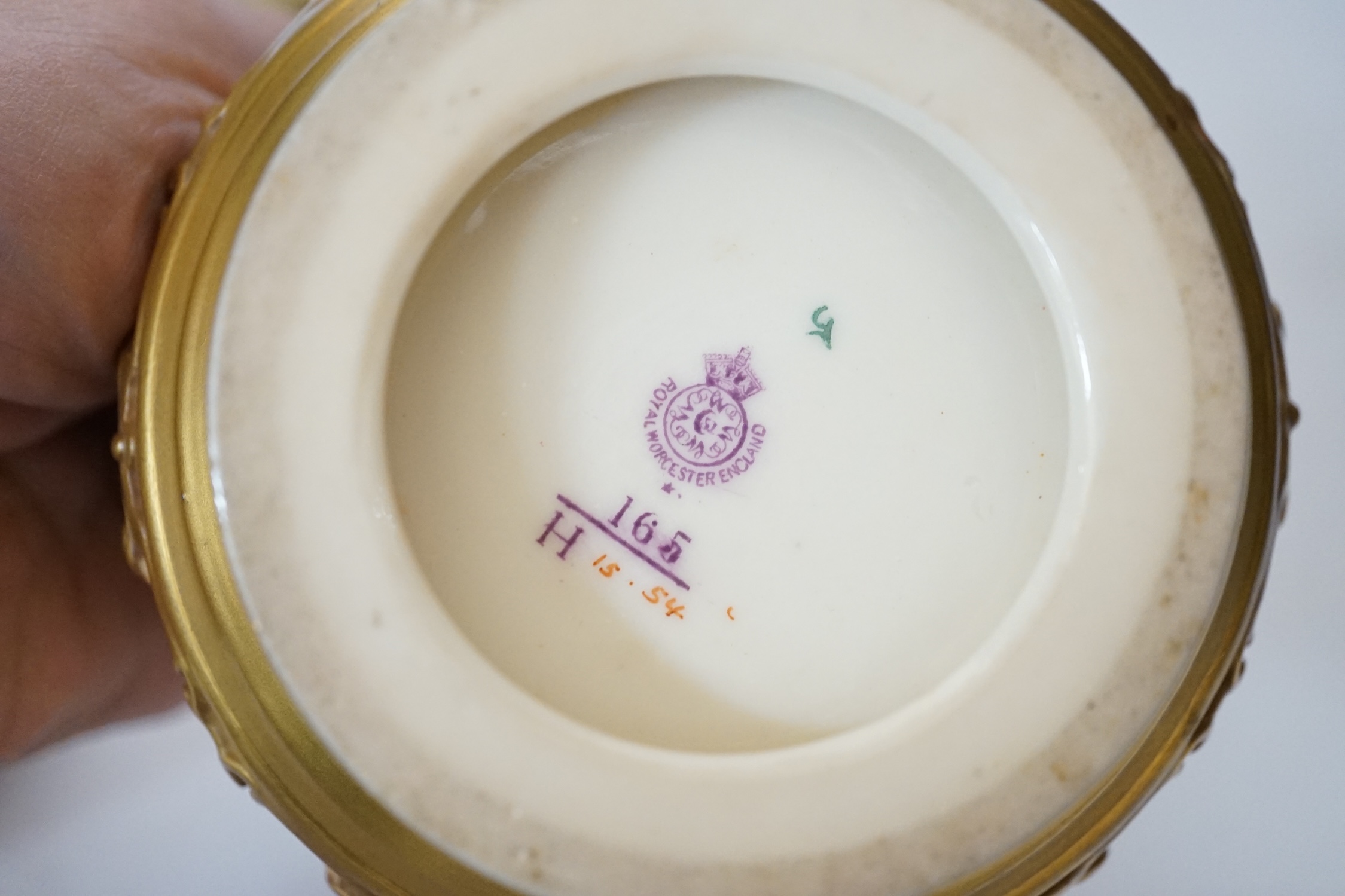 Three Royal Worcester blush ivory pots, one with an inner lid and pierced outer lid, tallest 14cm